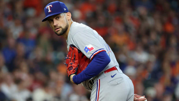 Rangers pitcher Nathan Eovaldi looks over to first from the mound in Game 2 of the 2023 ALCS